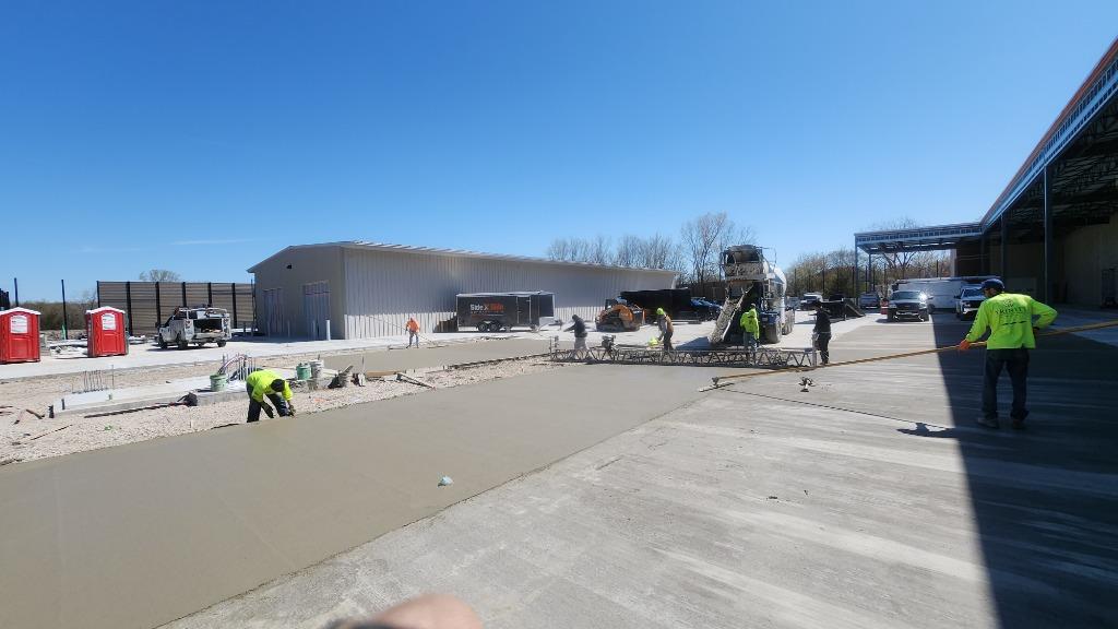 Trinity Construction crew pouring a commercial concrete driveway in Brookfield, Wisconsin
